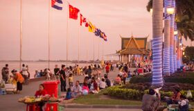 Capture the lively glow of Cambodia’s riverside nightlife